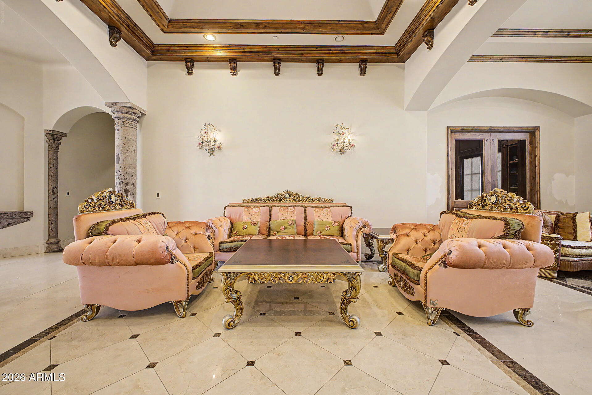 6525 North Lost Dutchman Road Paradise Valley, AZ 85253 - Photo 16 of 81 a bedroom with a bed and a chandelier