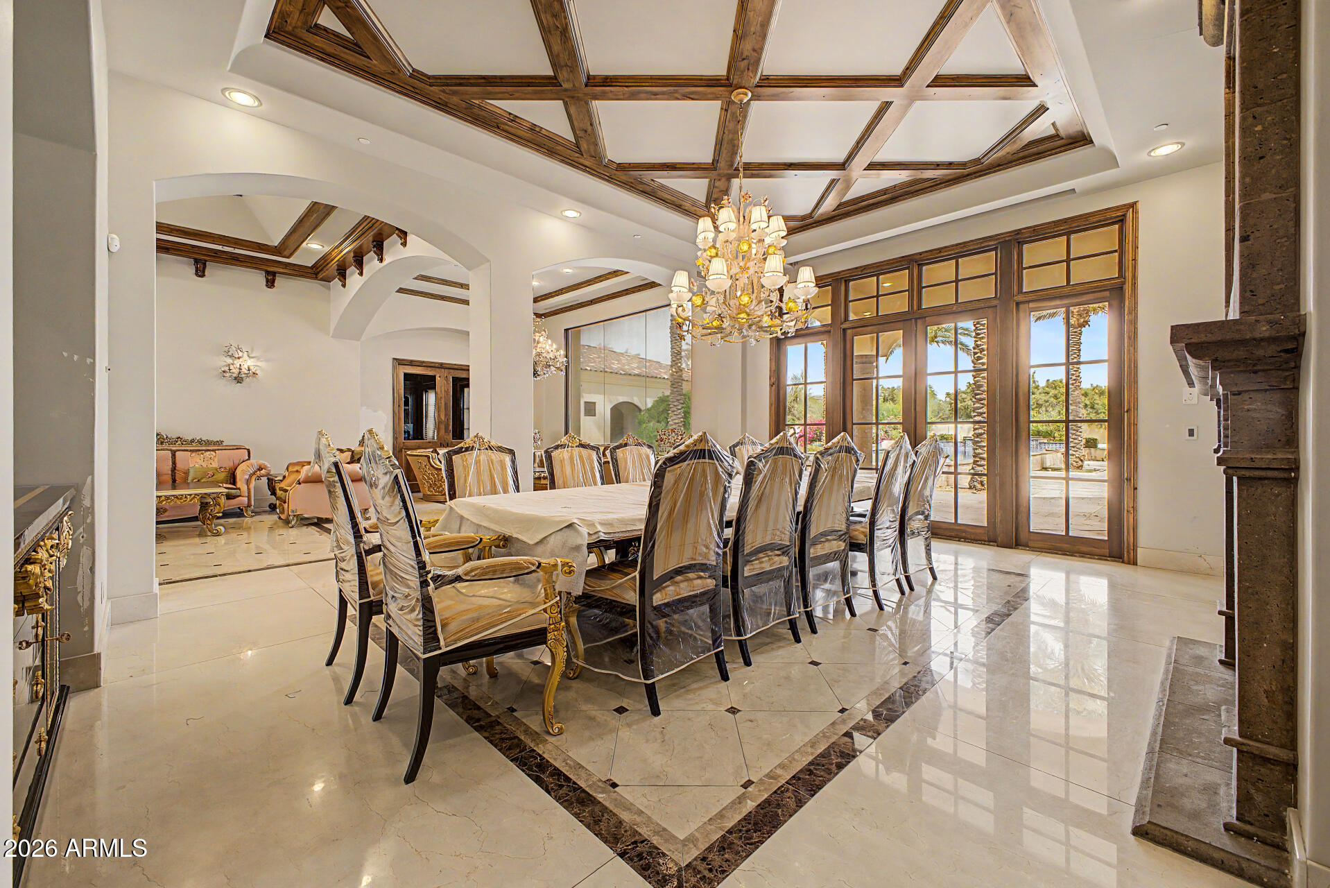 6525 North Lost Dutchman Road Paradise Valley, AZ 85253 - Photo 22 of 81 a view of a dining room with furniture a chandelier and wooden floor