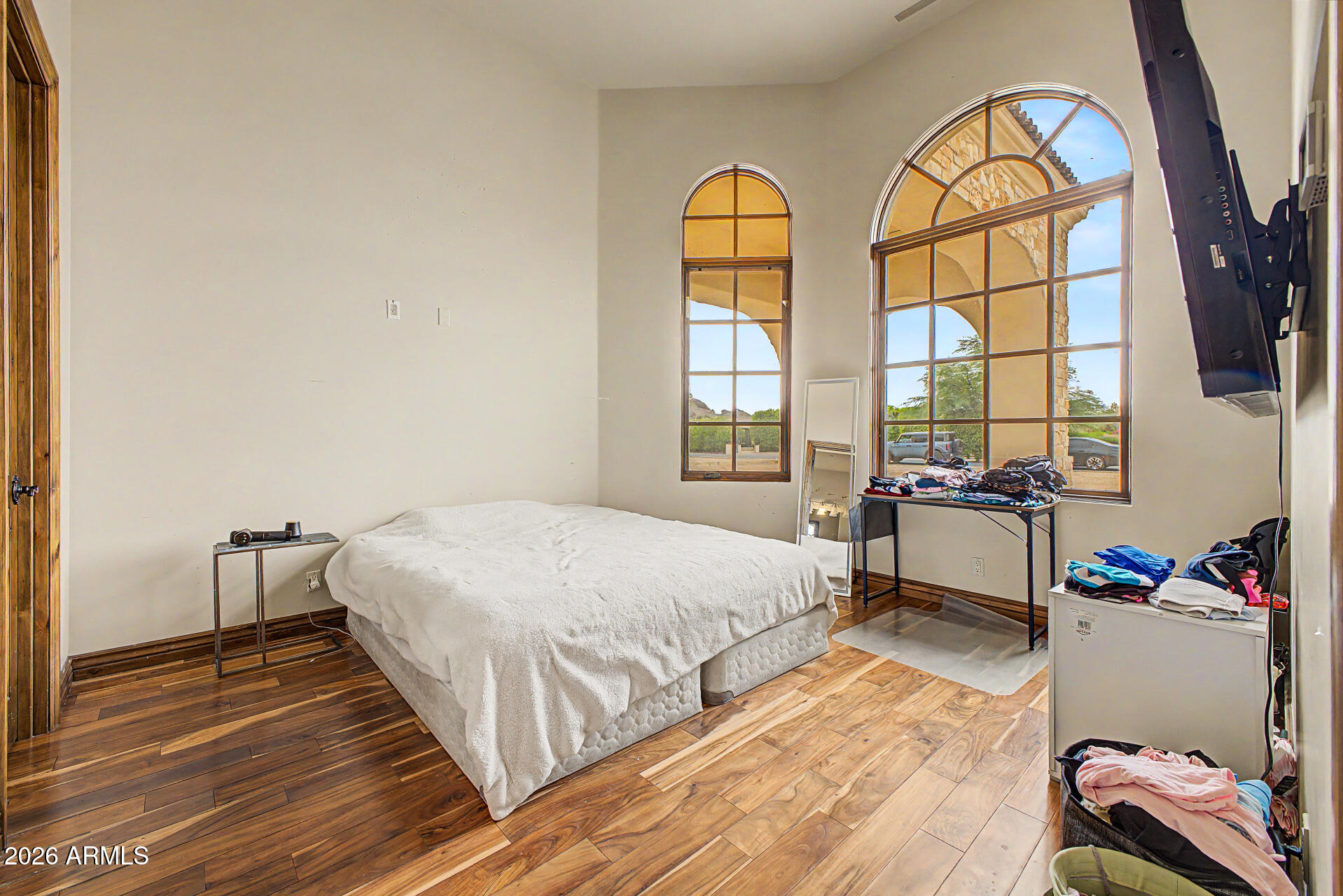 6525 North Lost Dutchman Road Paradise Valley, AZ 85253 - Photo 46 of 81 a bedroom with a bed and a window