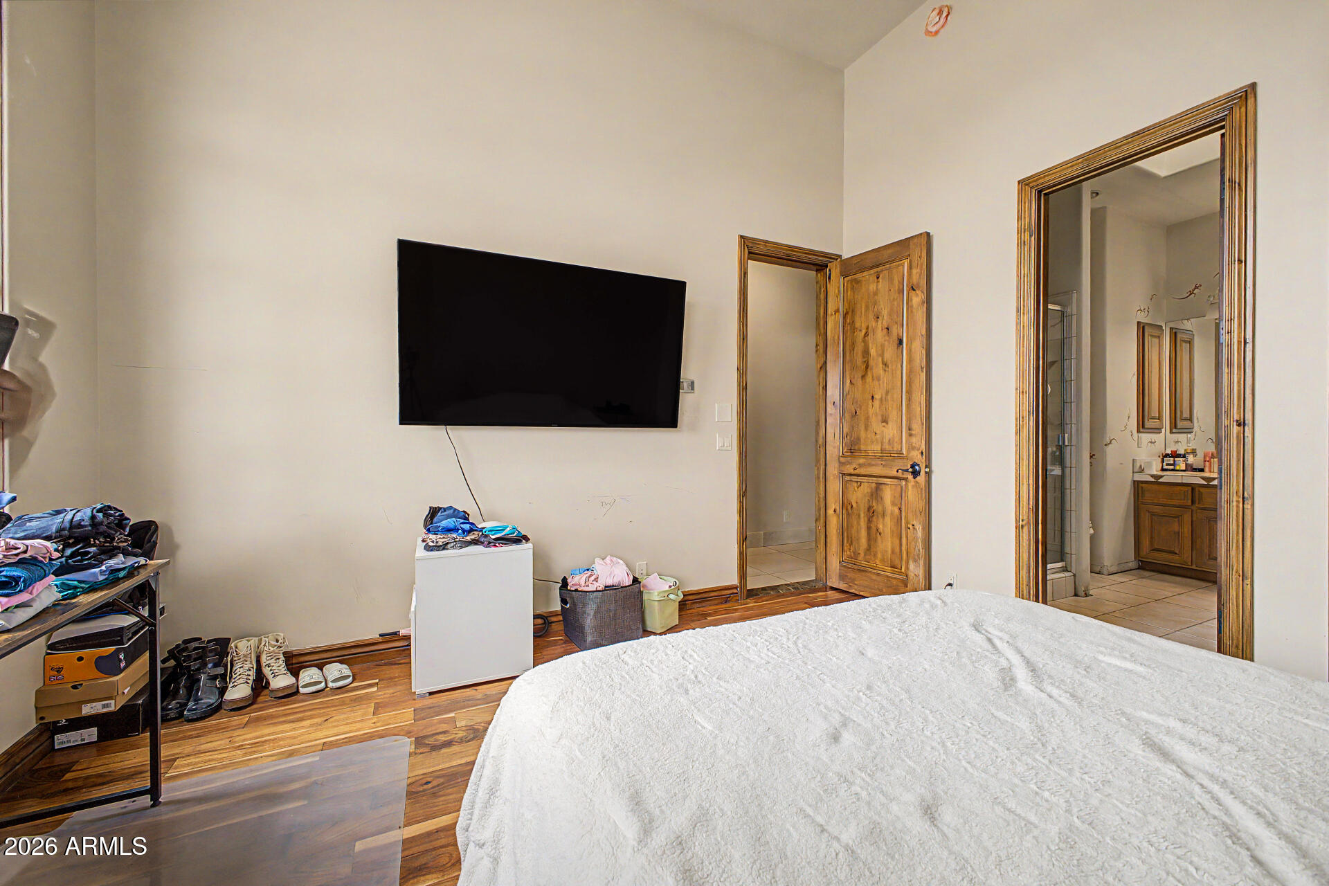 6525 North Lost Dutchman Road Paradise Valley, AZ 85253 - Photo 47 of 81 a bedroom with a bed and a flat screen tv
