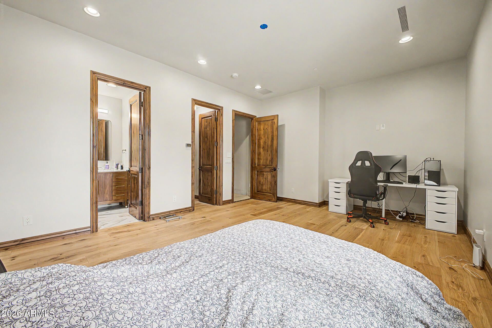 6525 North Lost Dutchman Road Paradise Valley, AZ 85253 - Photo 51 of 81 a bedroom with a bed and a chair