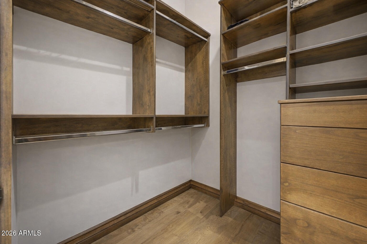 6525 North Lost Dutchman Road Paradise Valley, AZ 85253 - Photo 58 of 81 a view of walk in closet with empty racks