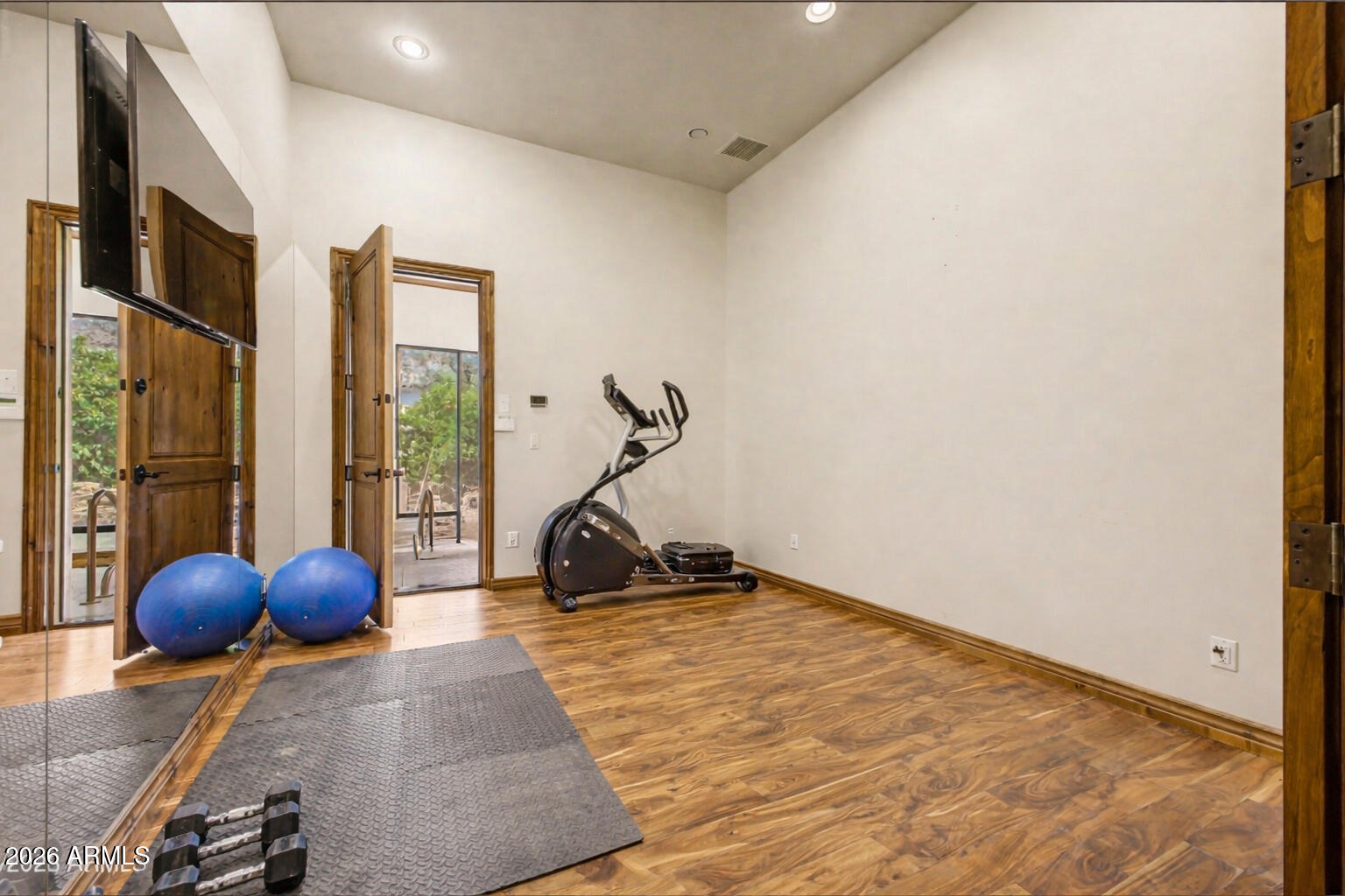 6525 North Lost Dutchman Road Paradise Valley, AZ 85253 - Photo 60 of 81 a room with a door and chandelier