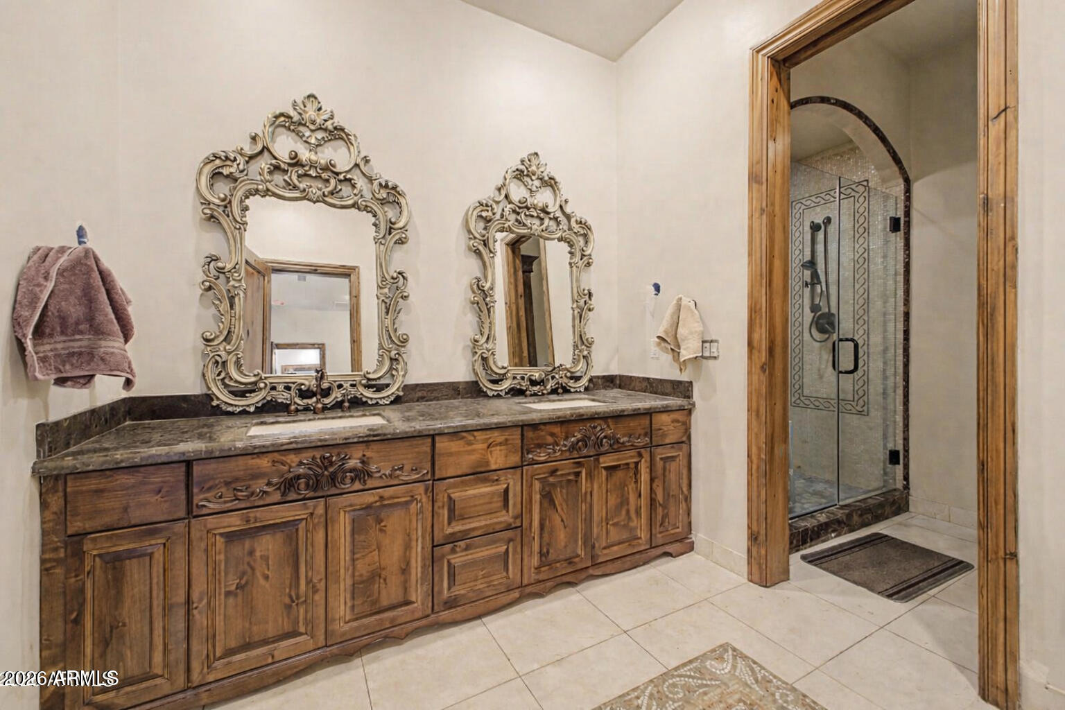 6525 North Lost Dutchman Road Paradise Valley, AZ 85253 - Photo 62 of 81 a spacious bathroom with a granite countertop sink mirror and shower