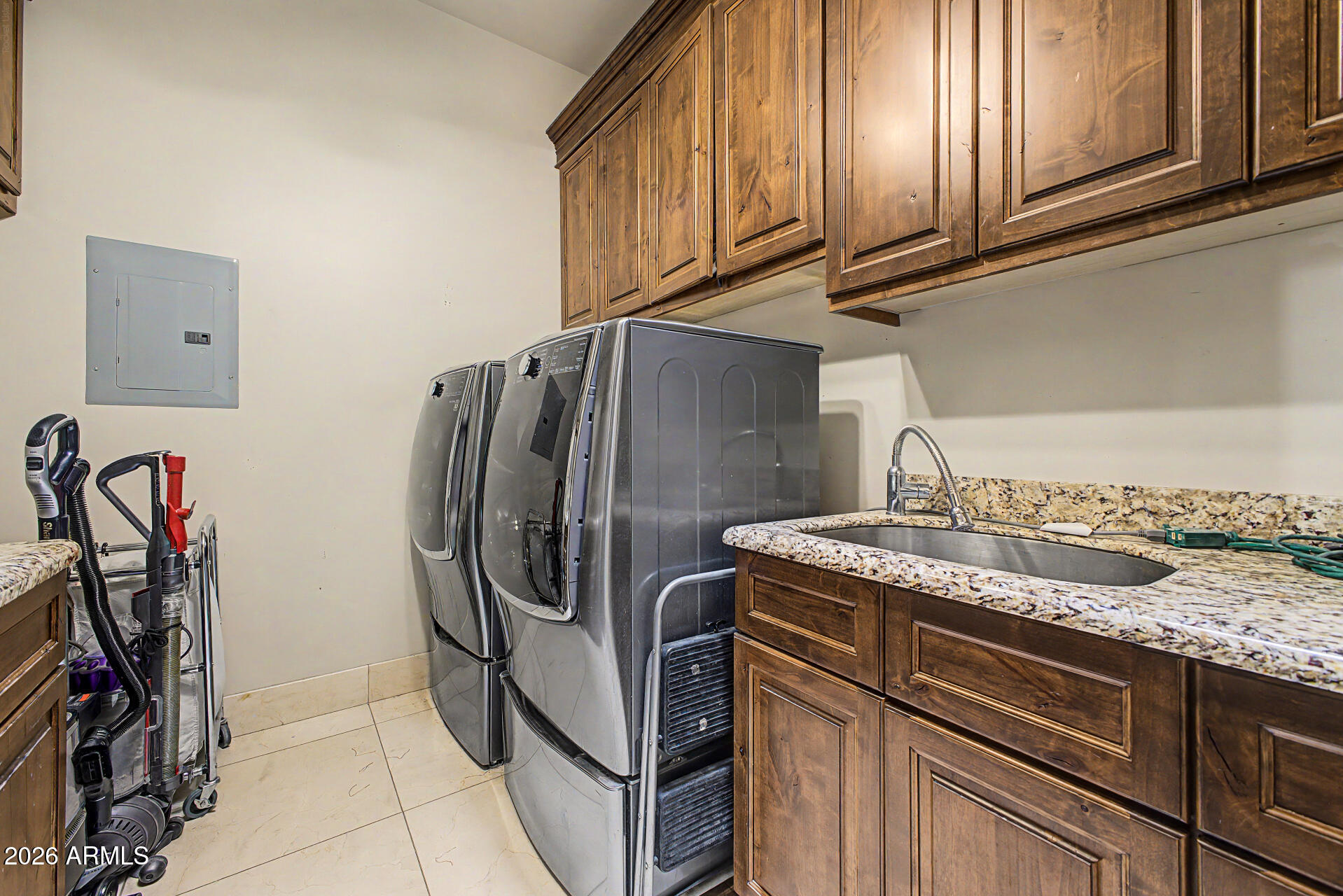 6525 North Lost Dutchman Road Paradise Valley, AZ 85253 - Photo 68 of 81 a kitchen with stainless steel appliances granite countertop a sink and cabinets