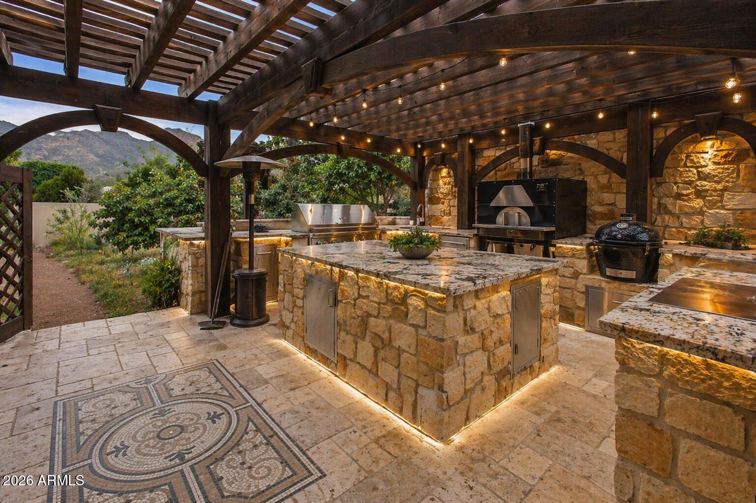 6525 North Lost Dutchman Road Paradise Valley, AZ 85253 - Photo 78 of 81 a view of a kitchen with furniture and a grill