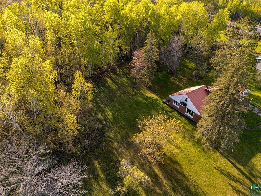 4543 County Road East South Range, WI 54874 - Photo 7 of 43 Single-story residence featuring a red gable roof and white siding