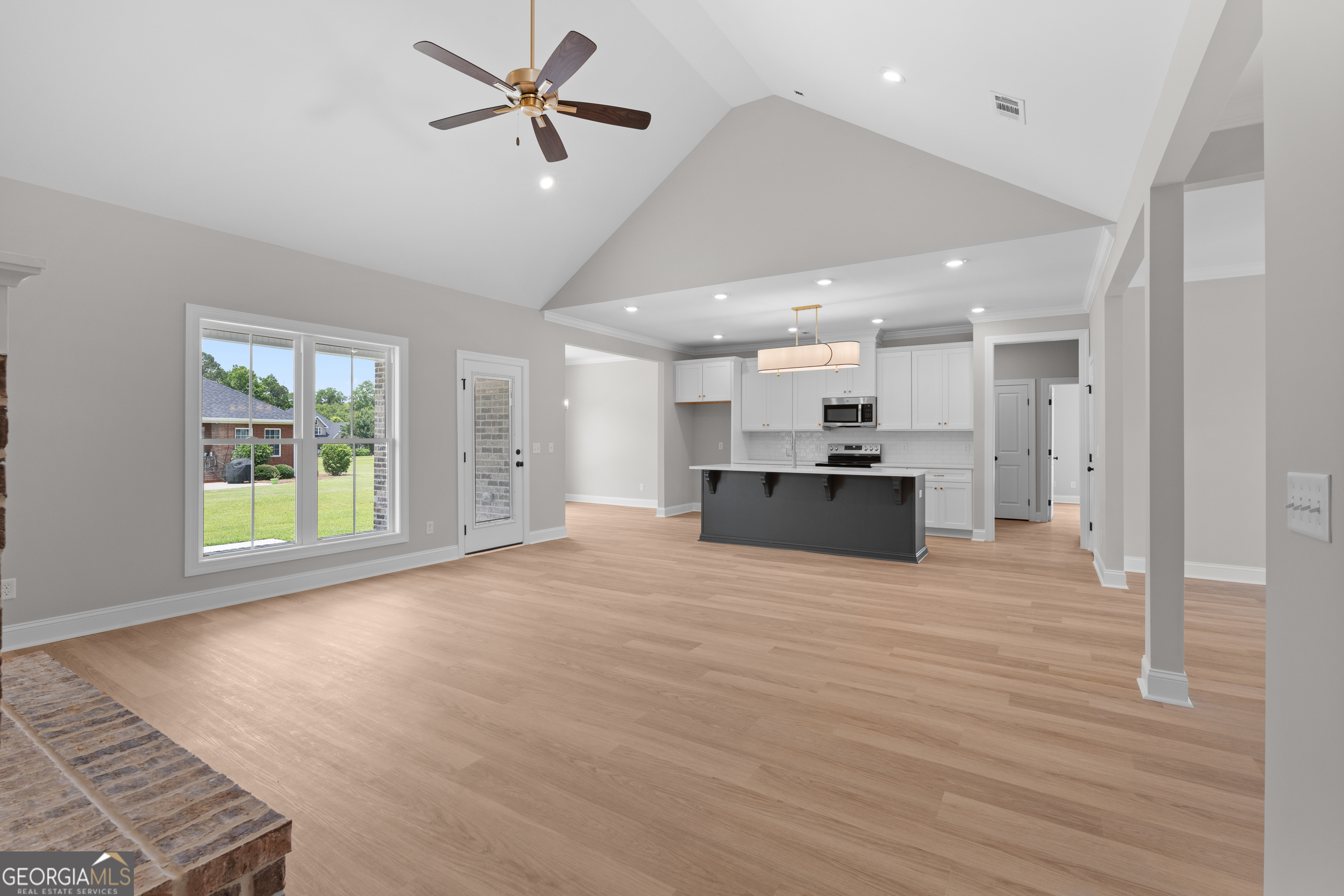 10 Honeysuckle Drive Claxton, GA 30417 - Photo 11 of 42 a view of kitchen and hall with wooden floor