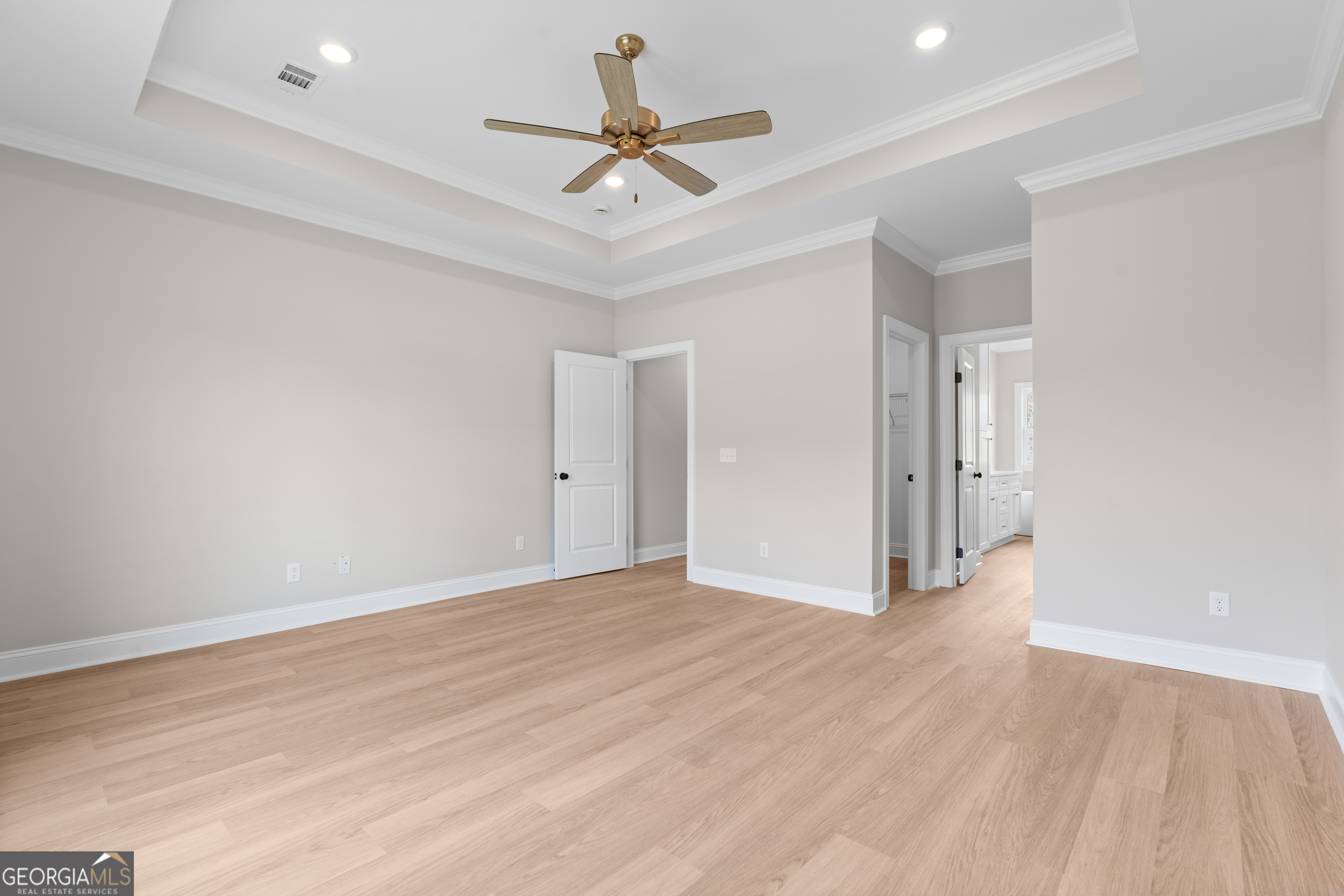 10 Honeysuckle Drive Claxton, GA 30417 - Photo 19 of 42 an empty room with wooden floor and ceiling fan