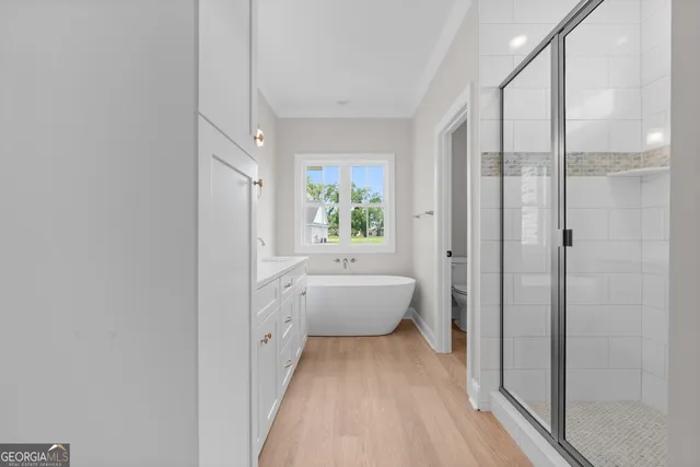 a bathroom with a bathtub and a shower