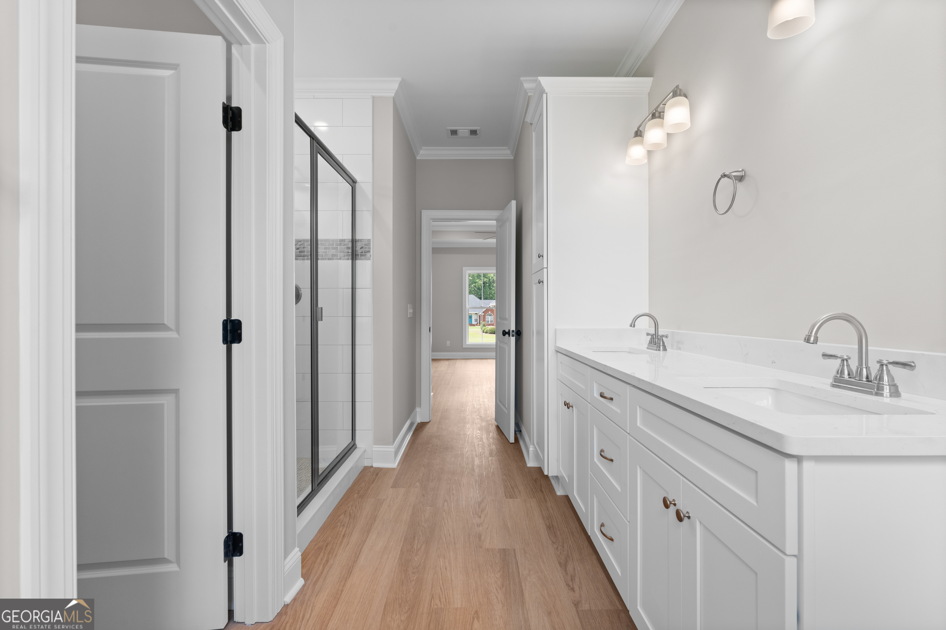 10 Honeysuckle Drive Claxton, GA 30417 - Photo 21 of 42 a spacious bathroom with a double vanity sink and mirror