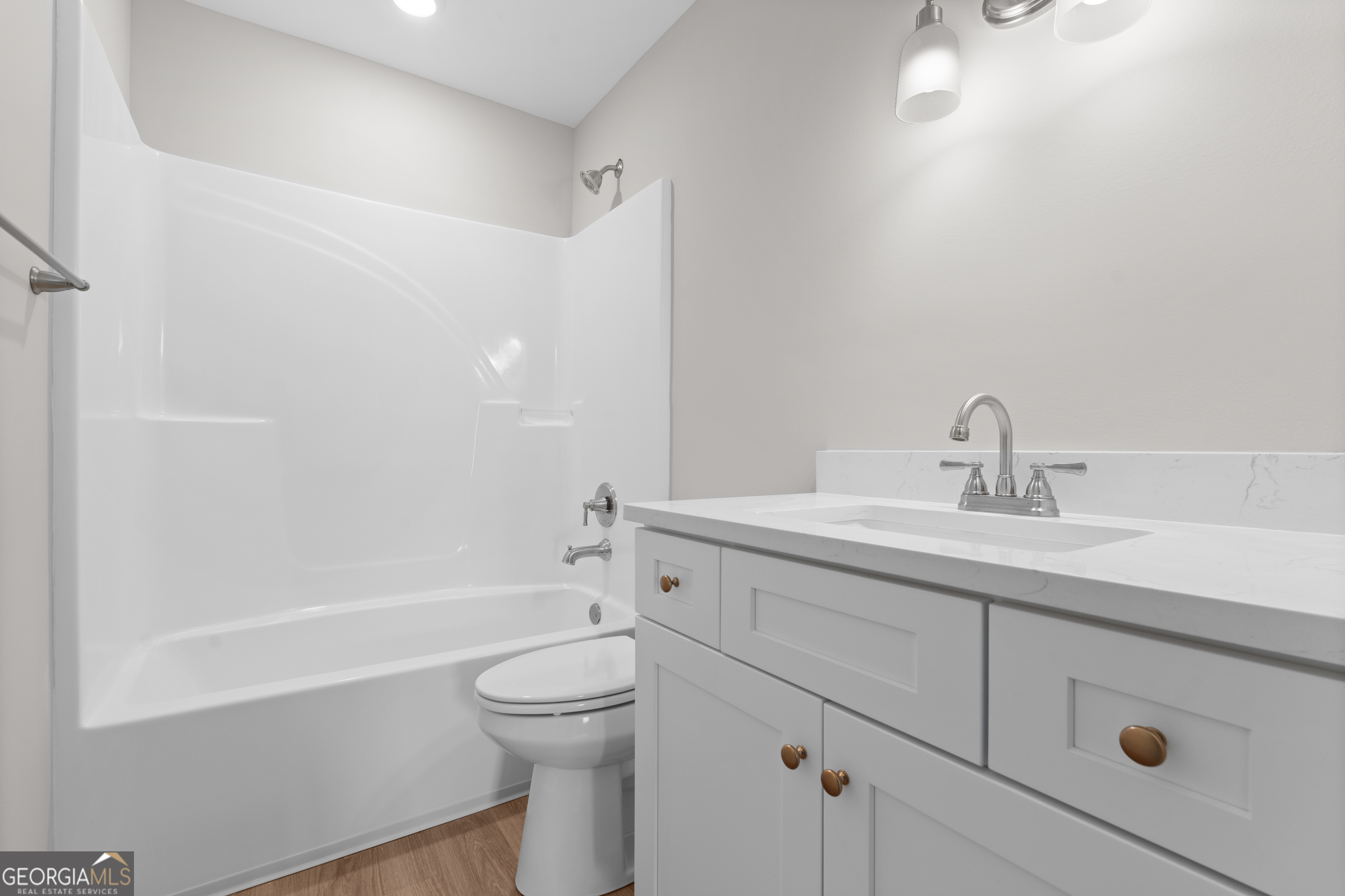 10 Honeysuckle Drive Claxton, GA 30417 - Photo 31 of 42 a bathroom with a sink a toilet and shower