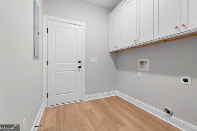 a view of empty room with cabinet