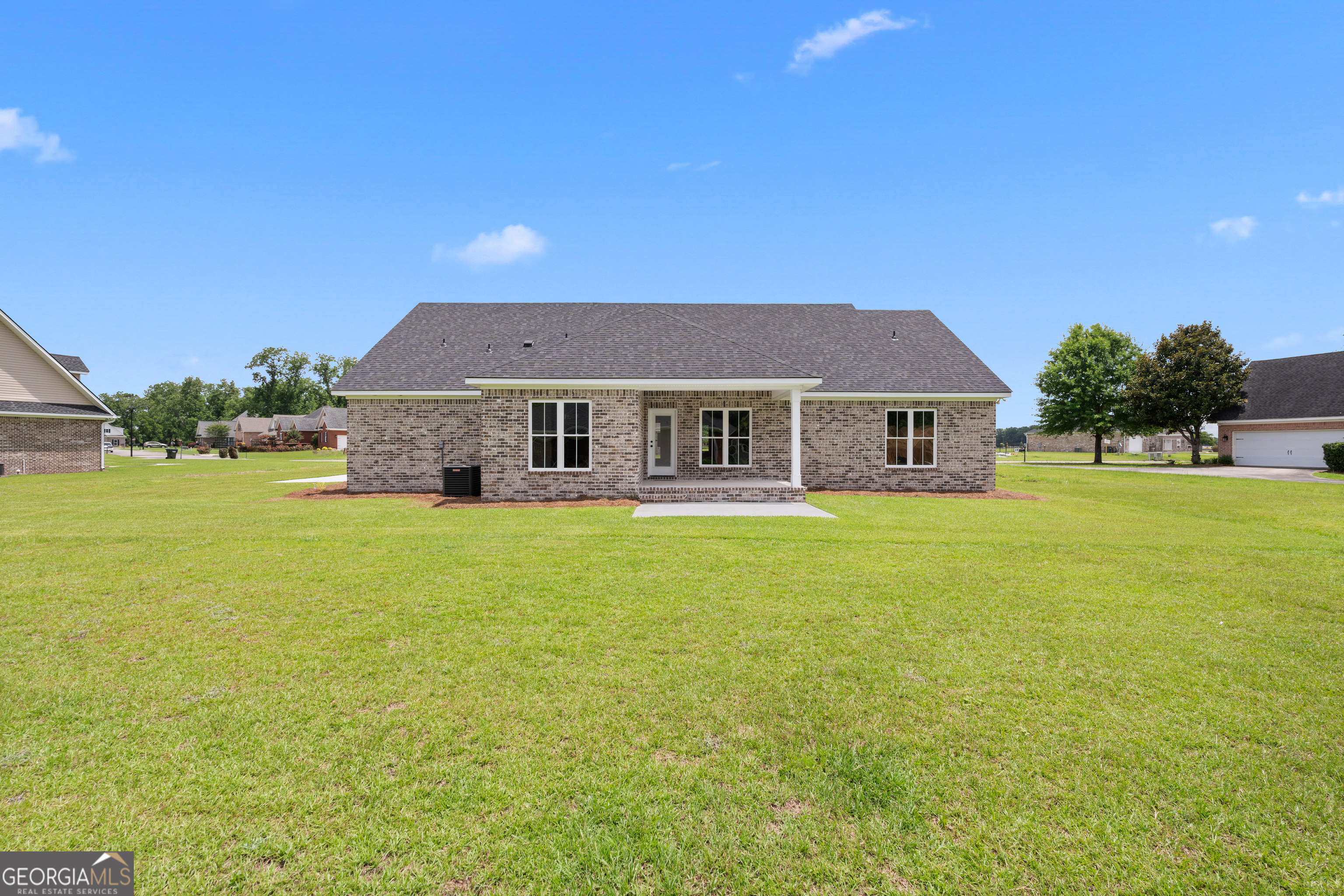 10 Honeysuckle Drive Claxton, GA 30417 - Photo 34 of 42 a front view of a house with a garden