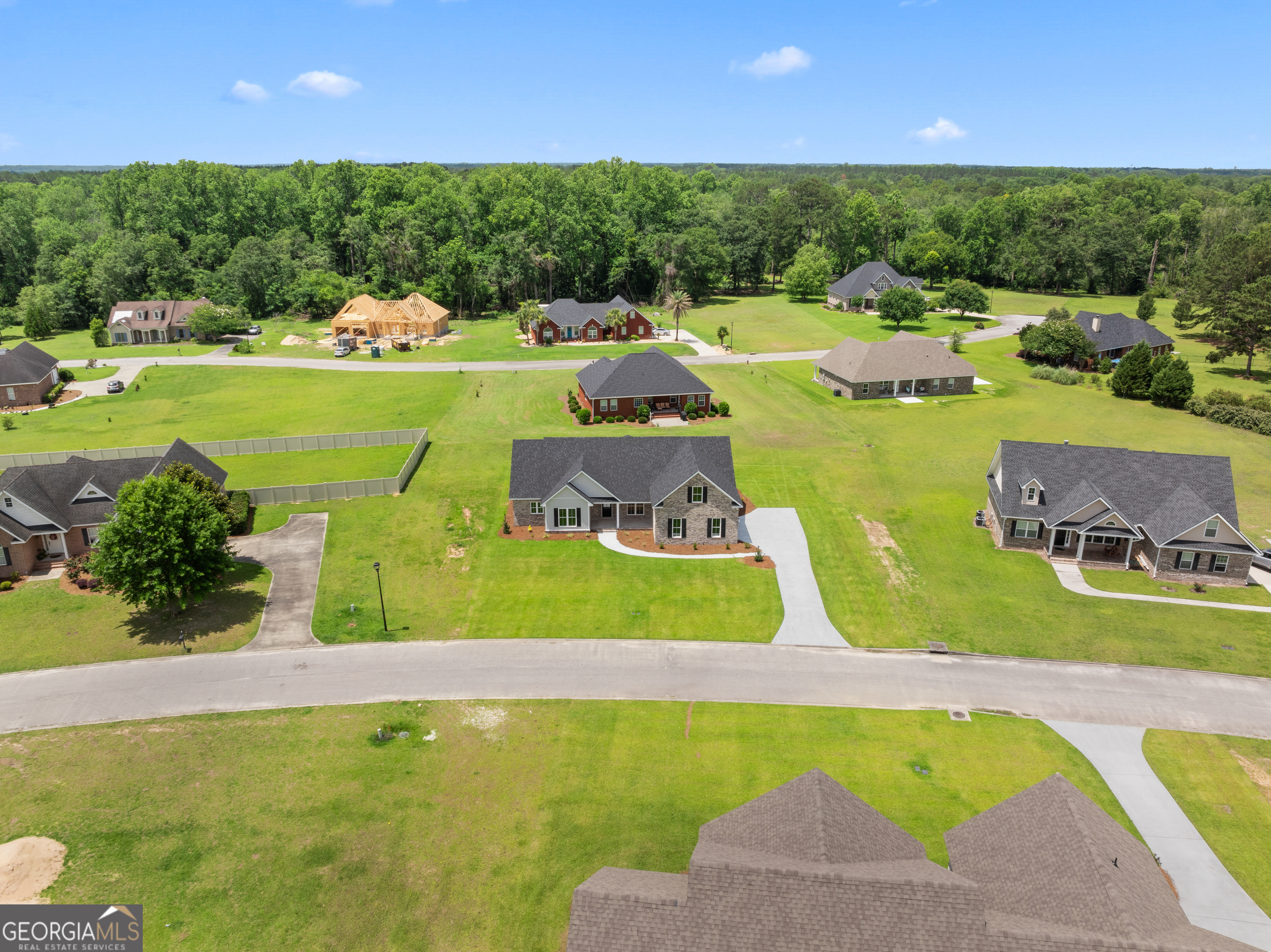 10 Honeysuckle Drive Claxton, GA 30417 - Photo 36 of 42 a view of a swimming pool and lounge chairs