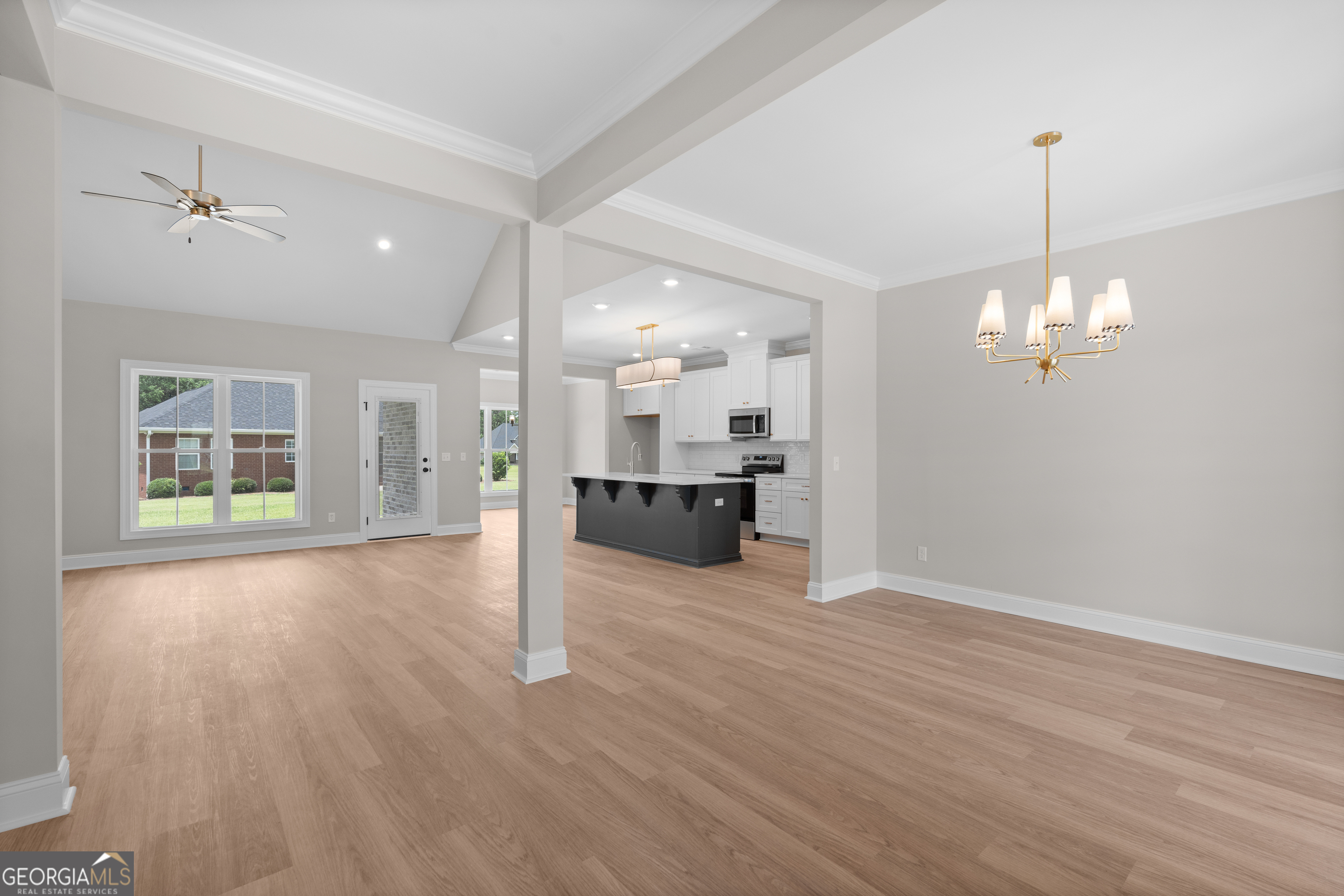 10 Honeysuckle Drive Claxton, GA 30417 - Photo 7 of 42 a view of a kitchen with a sink cabinet fire place and wooden floor