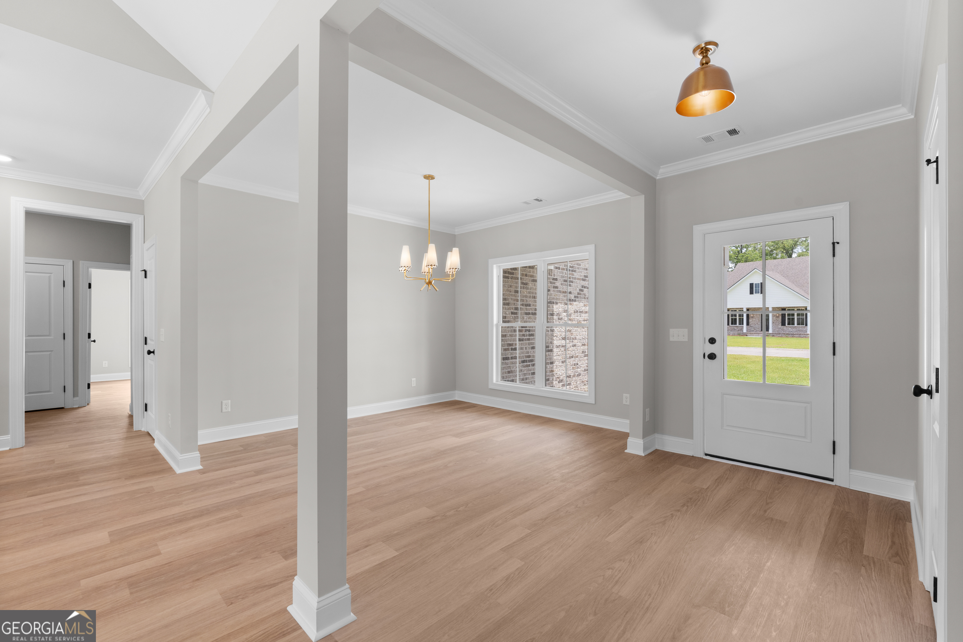10 Honeysuckle Drive Claxton, GA 30417 - Photo 9 of 42 wooden floor in an empty room with a window