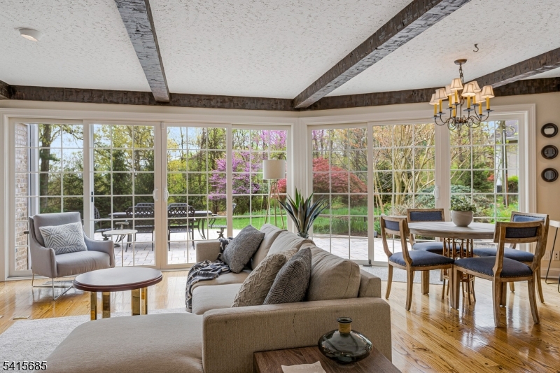 167 Ridge Road Watchung, NJ 07069 - Photo 14 of 50 a living room with furniture and a floor to ceiling window