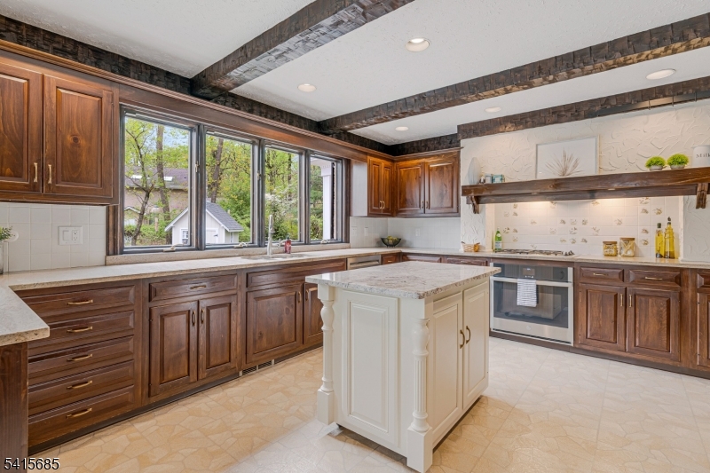 167 Ridge Road Watchung, NJ 07069 - Photo 16 of 50 a kitchen with a stove sink and cabinets