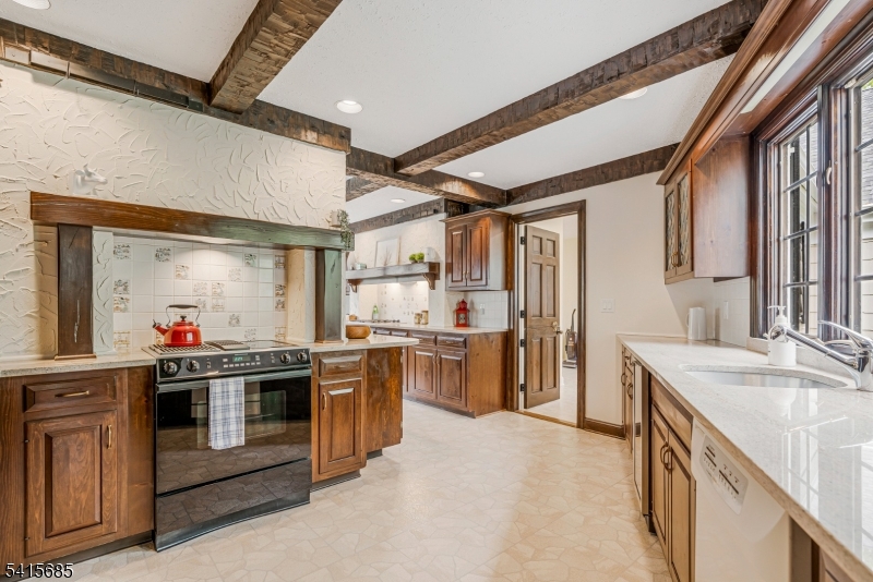 167 Ridge Road Watchung, NJ 07069 - Photo 21 of 50 a kitchen with stove and cabinets