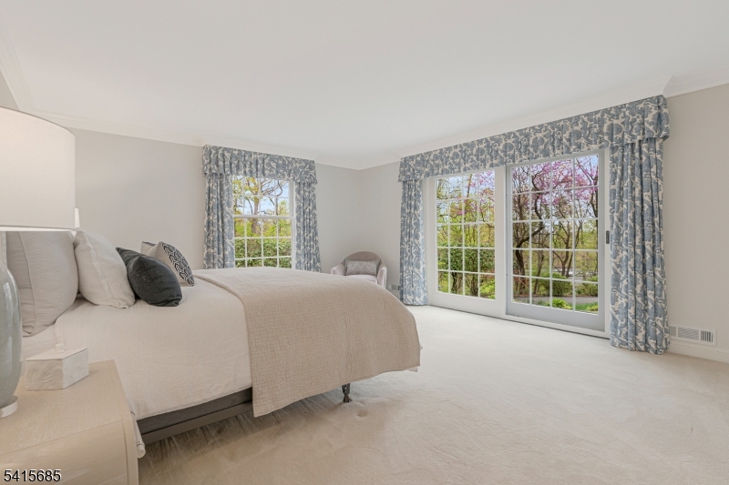 167 Ridge Road Watchung, NJ 07069 - Photo 26 of 50 a bedroom with a large bed and a large window