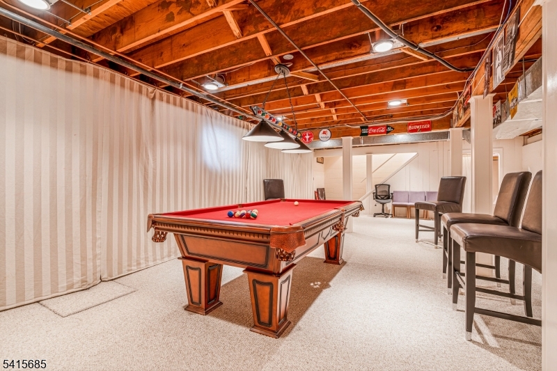 167 Ridge Road Watchung, NJ 07069 - Photo 35 of 50 a room with pool table and chairs