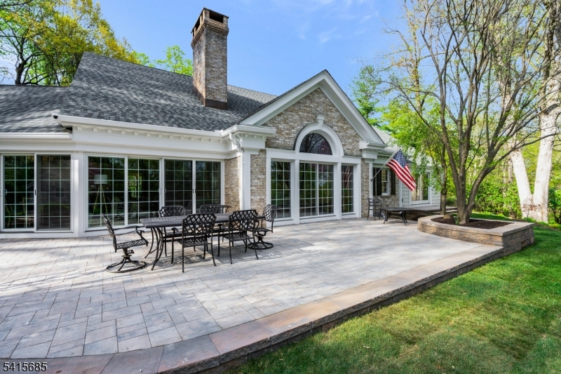 167 Ridge Road Watchung, NJ 07069 - Photo 40 of 50 a front view of a house with sitting area and garden