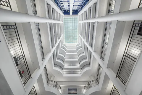 a view of staircase with railing and stairs