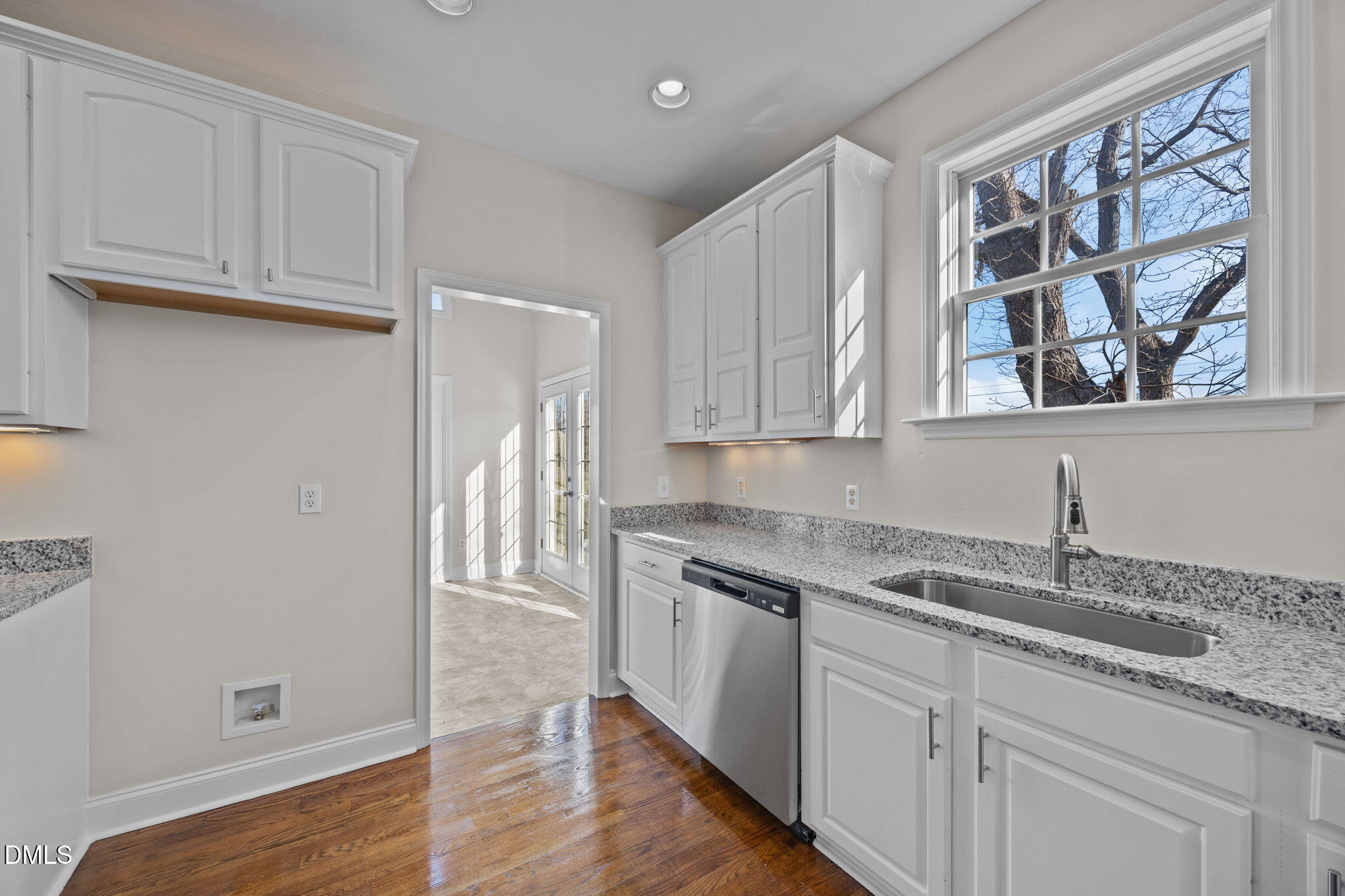 118 Kayleigh Court Willow Spring, NC 27592 - Photo 20 of 37 a kitchen with stainless steel appliances granite countertop a sink and cabinets with wooden floor