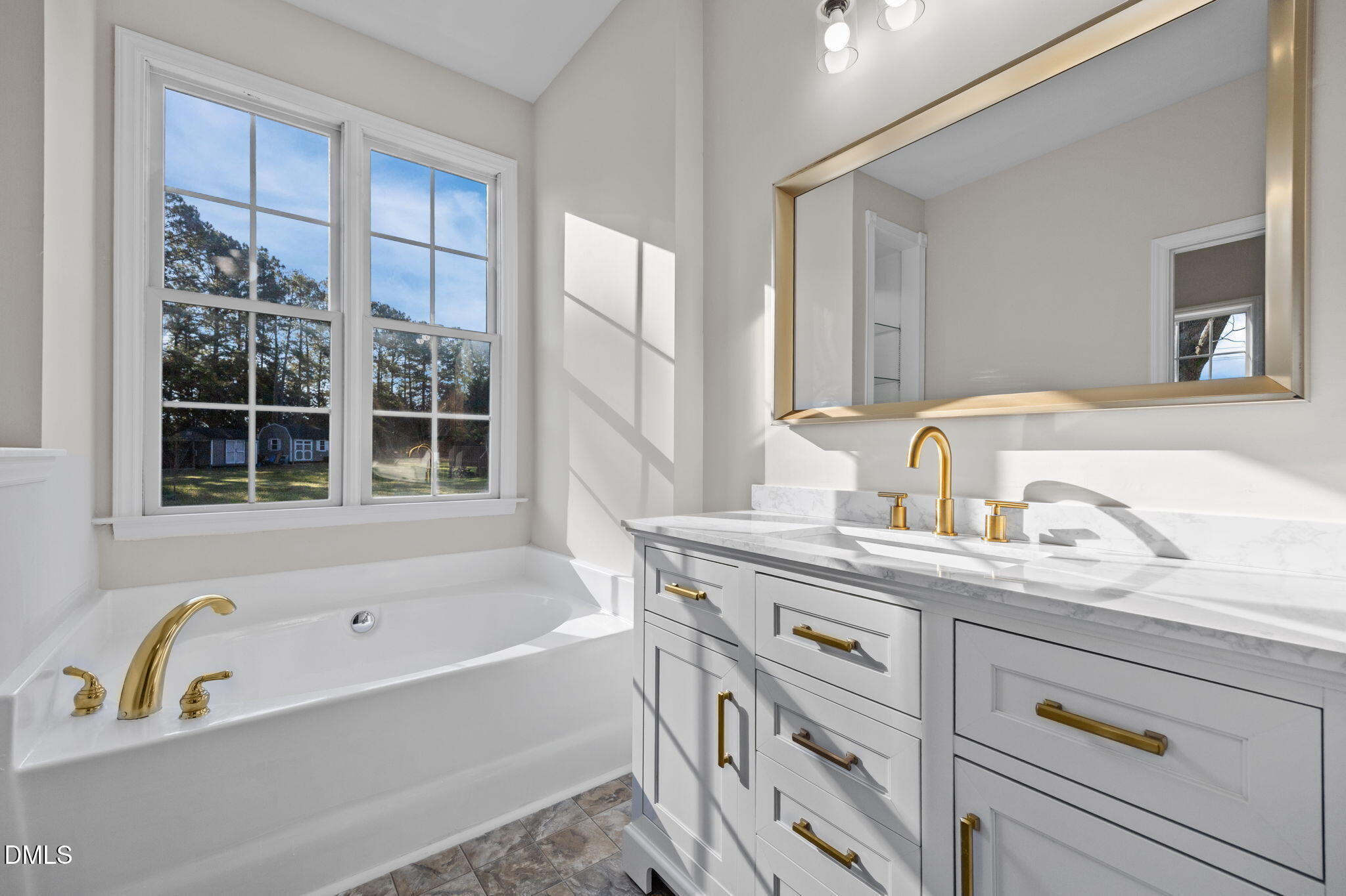 118 Kayleigh Court Willow Spring, NC 27592 - Photo 25 of 37 a bathroom with a tub sink and mirror