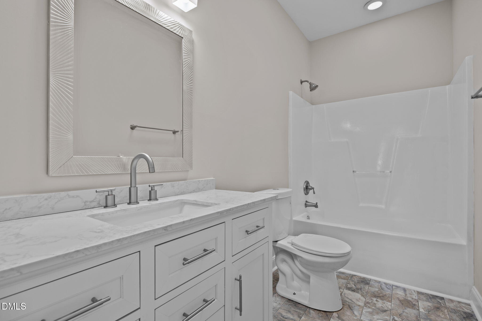118 Kayleigh Court Willow Spring, NC 27592 - Photo 29 of 37 a bathroom with a granite countertop toilet a sink and a bathtub