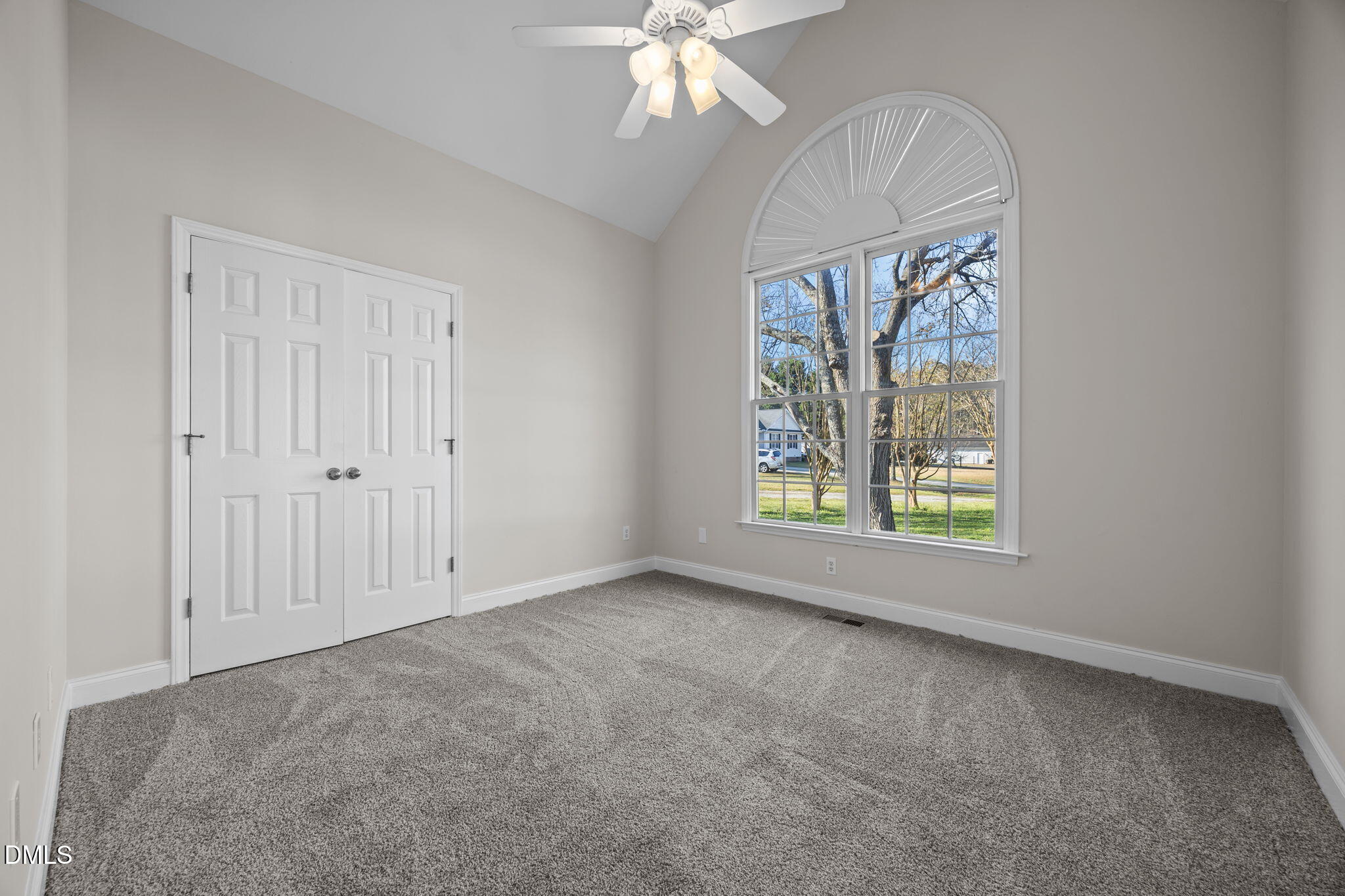 118 Kayleigh Court Willow Spring, NC 27592 - Photo 30 of 37 an empty room with chandelier fan and windows