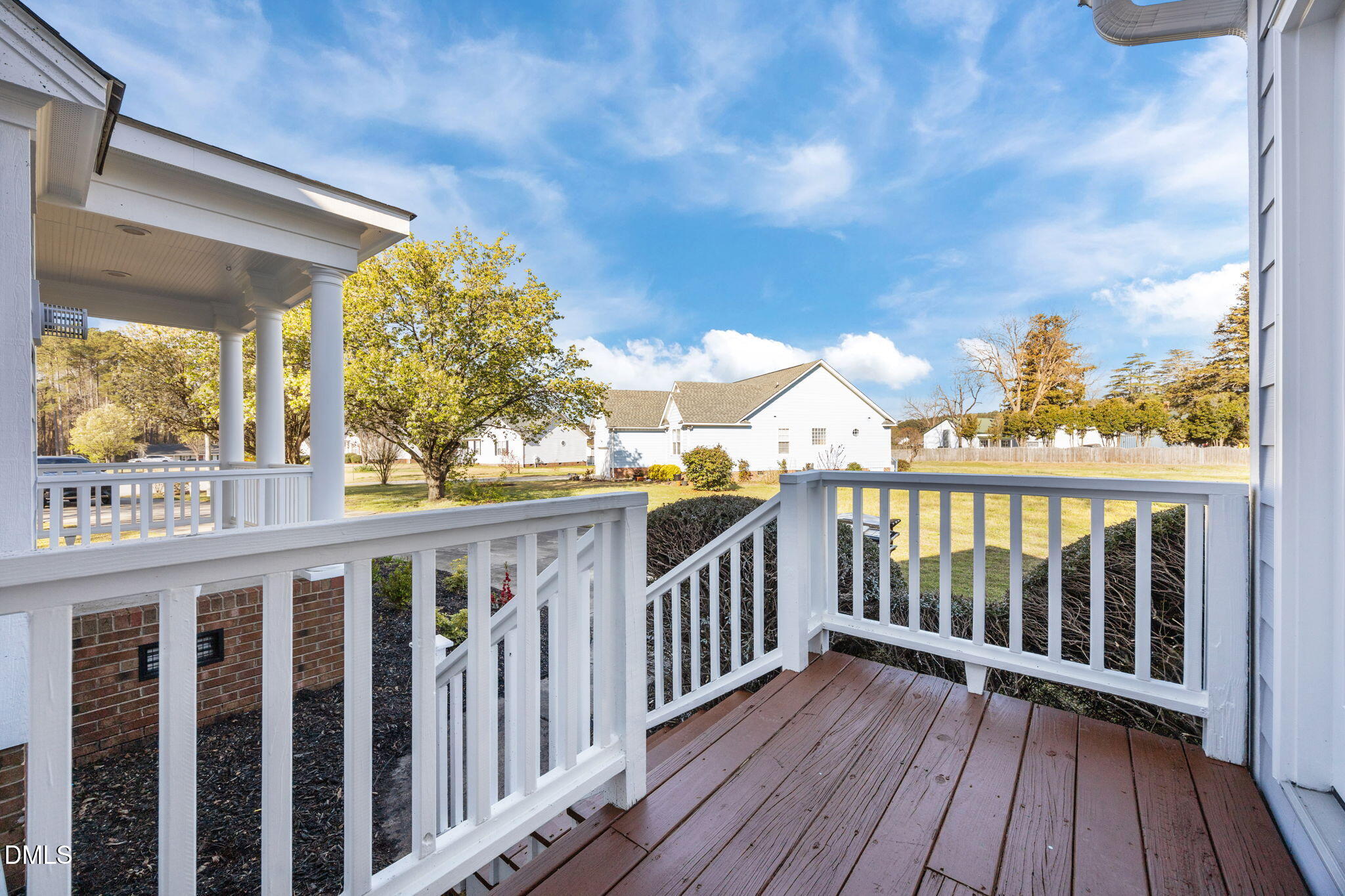 118 Kayleigh Court Willow Spring, NC 27592 - Photo 34 of 37 a view of a balcony with wooden floor