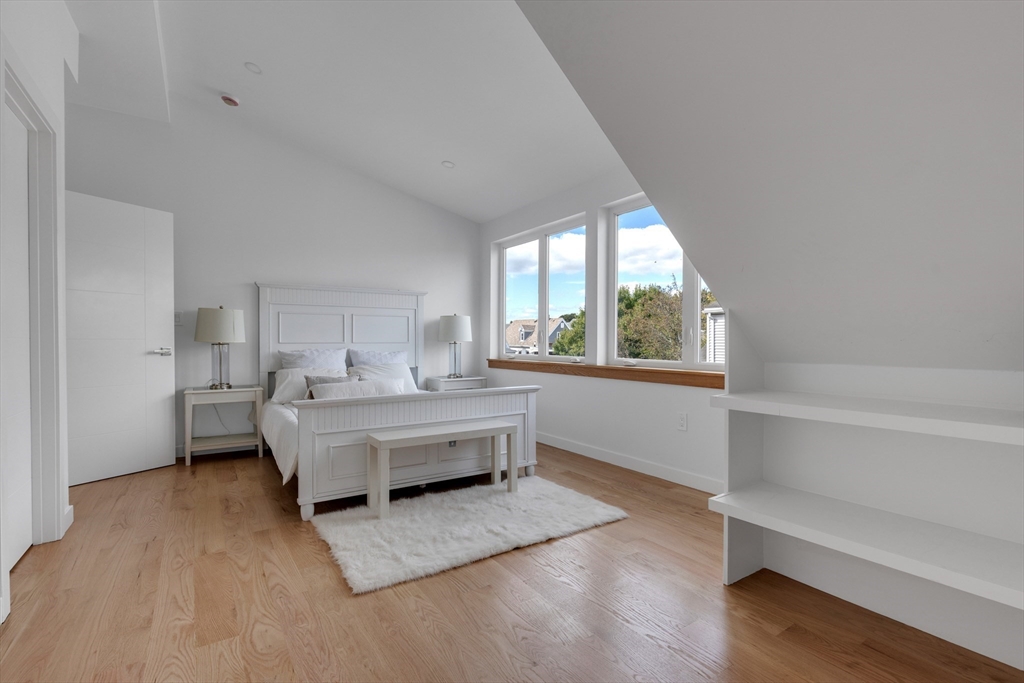 69 Boston Avenue, Unit 69 Somerville, MA 02144 - Photo 11 of 26 a living room with furniture and a large window