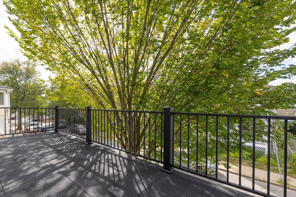 69 Boston Avenue, Unit 69 Somerville, MA 02144 - Photo 18 of 26 a balcony with yard