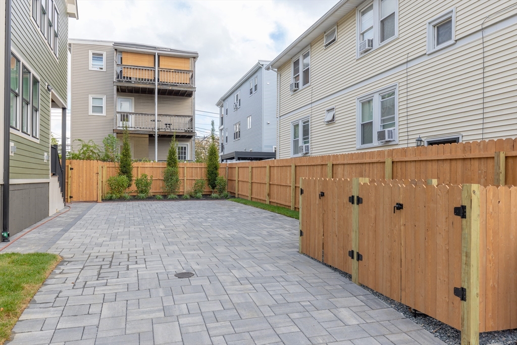69 Boston Avenue, Unit 69 Somerville, MA 02144 - Photo 20 of 26 a view of a street with parking space