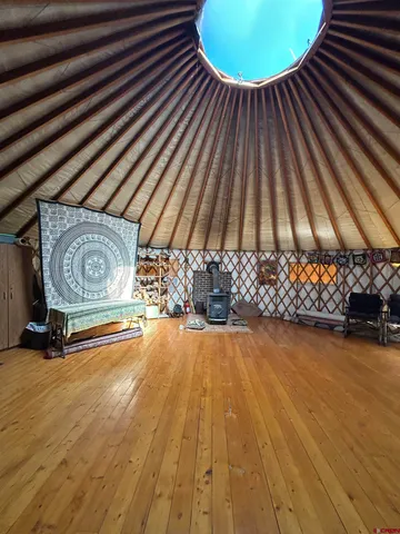 a view of a room with wooden floor