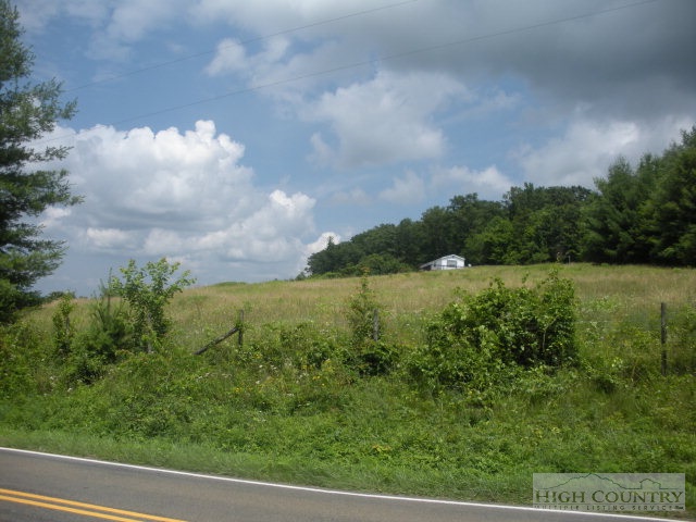 73 Smith Acres Road Ennice, NC 28623 - Photo 14 of 22 a view of a lake from a yard
