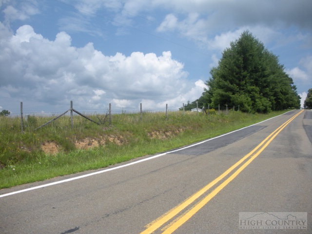 73 Smith Acres Road Ennice, NC 28623 - Photo 15 of 22 a view of a city street with a big yard