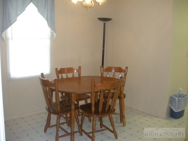 73 Smith Acres Road Ennice, NC 28623 - Photo 22 of 22 a view of a dining table and chairs