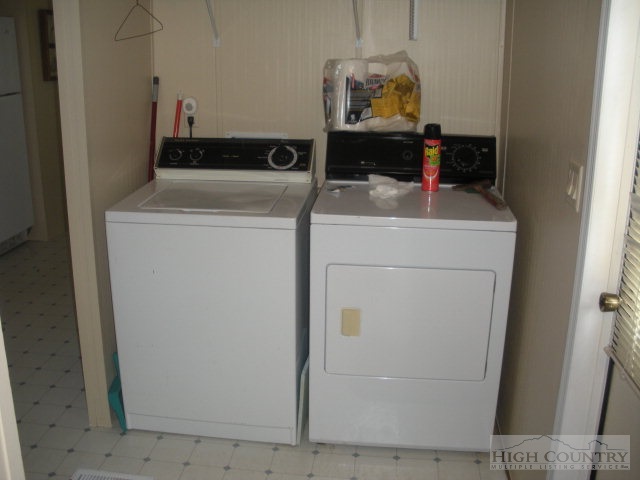 73 Smith Acres Road Ennice, NC 28623 - Photo 4 of 22 a utility room with dryer and washer
