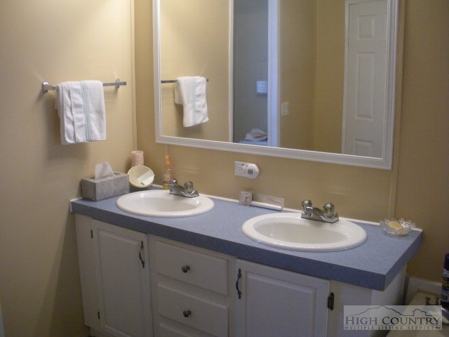 73 Smith Acres Road Ennice, NC 28623 - Photo 8 of 22 a bathroom with a sink and a mirror