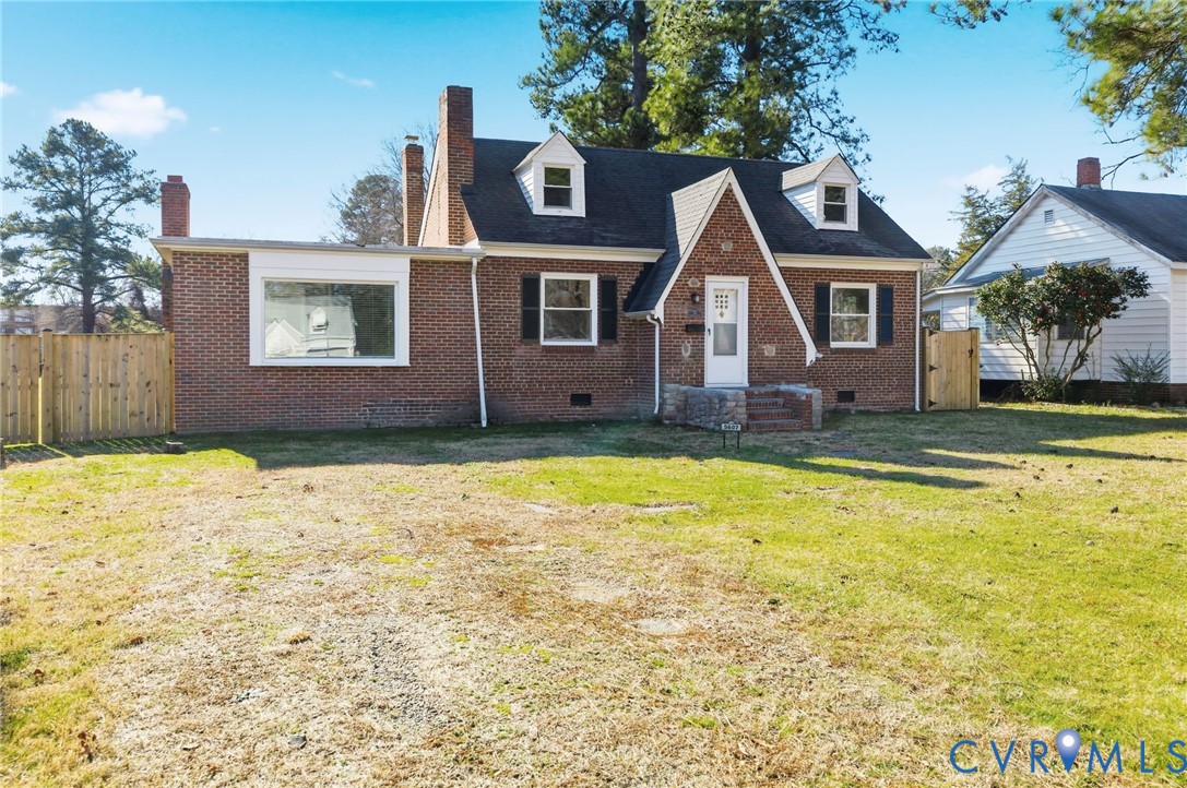 Tudor-style house featuring crawl space, brick sid
