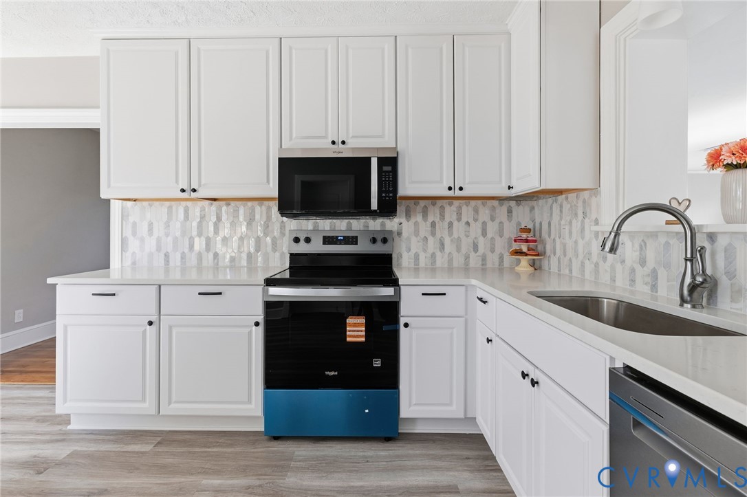 5607 Jahnke Road Richmond, VA 23225 - Photo 14 of 28 Kitchen with stainless steel appliances, light sto