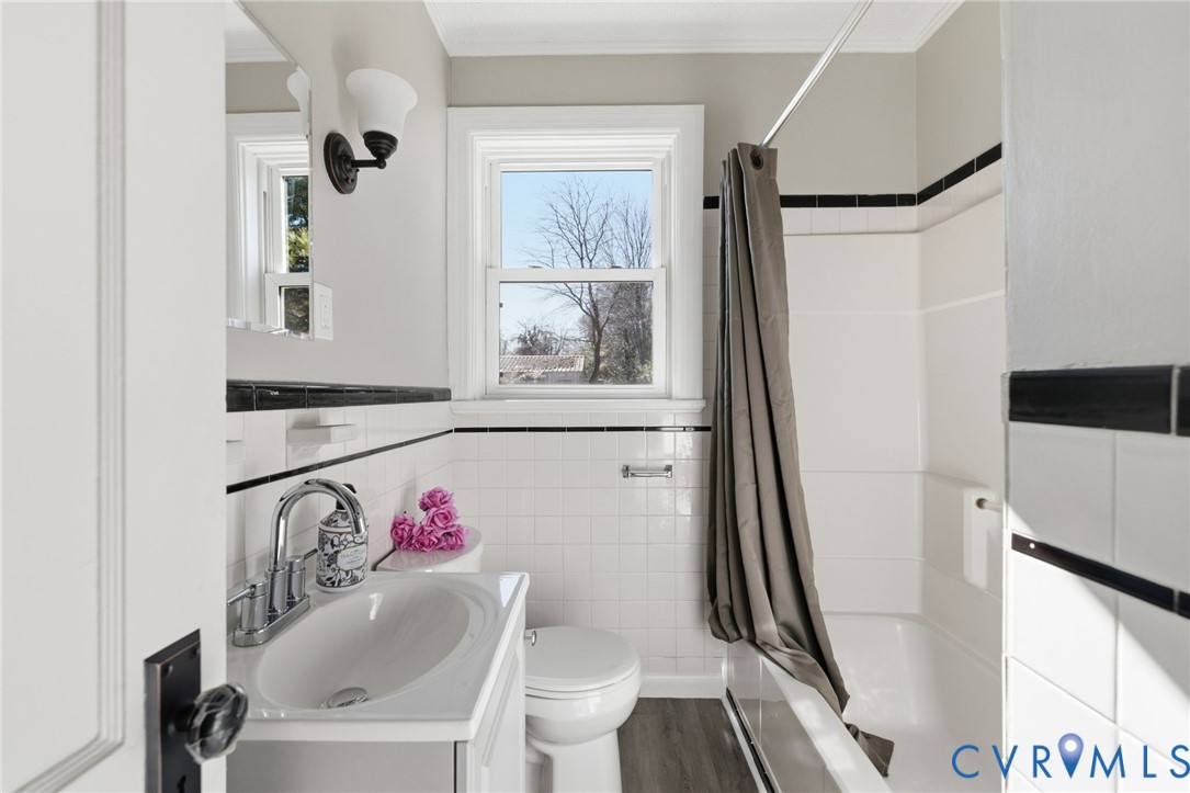 5607 Jahnke Road Richmond, VA 23225 - Photo 17 of 28 Bathroom featuring vanity, shower / tub combo with