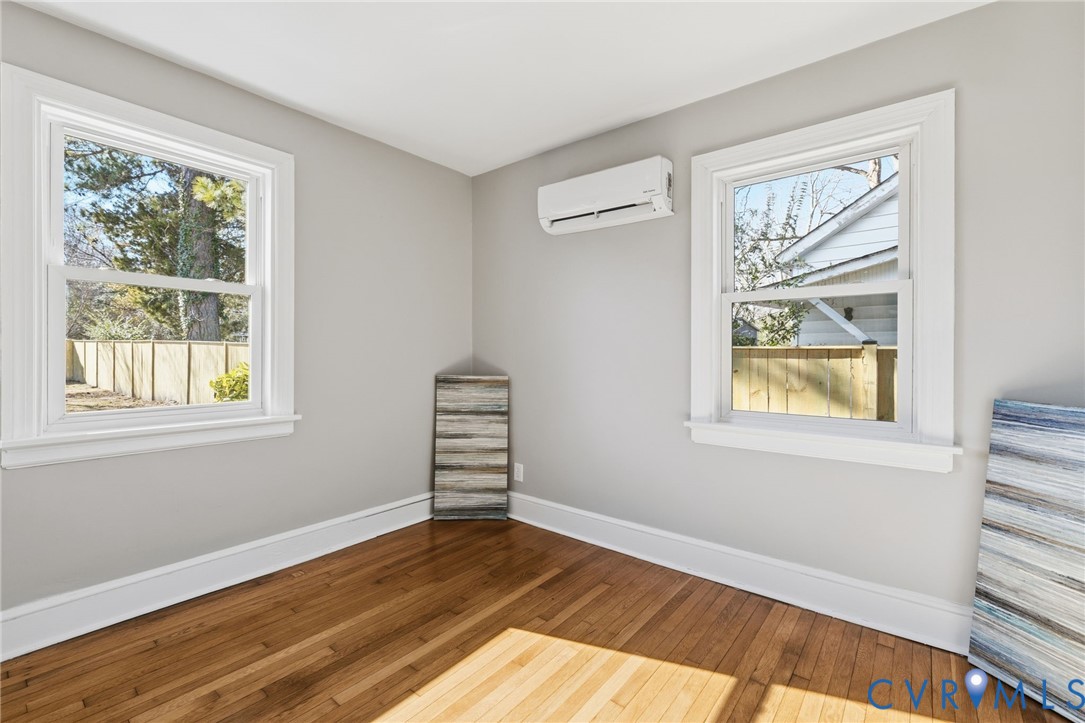 5607 Jahnke Road Richmond, VA 23225 - Photo 18 of 28 Empty room featuring hardwood / wood-style floors,