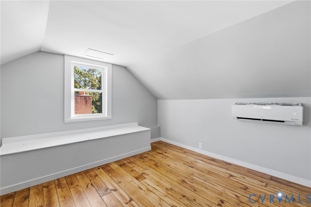 5607 Jahnke Road Richmond, VA 23225 - Photo 21 of 28 Additional living space with lofted ceiling, light