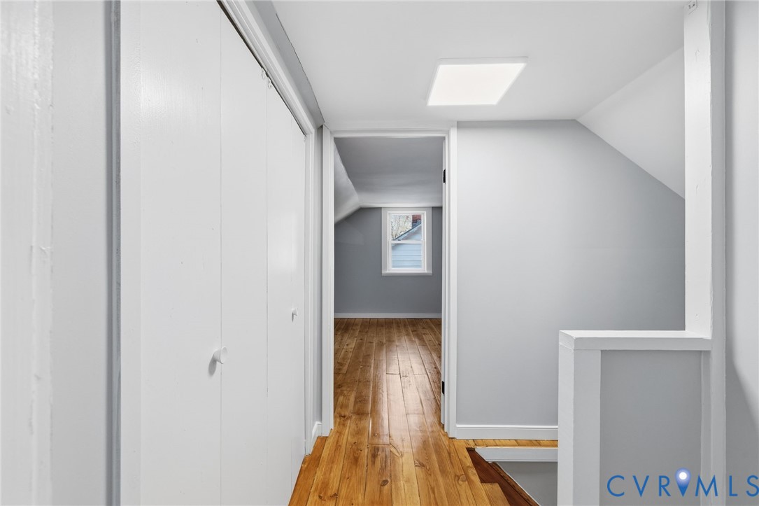 5607 Jahnke Road Richmond, VA 23225 - Photo 22 of 28 Hall featuring lofted ceiling, light wood finished