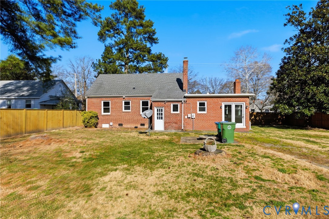 5607 Jahnke Road Richmond, VA 23225 - Photo 28 of 28 Rear view of property with a chimney, a fenced bac