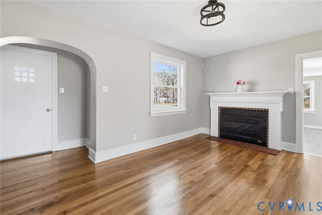5607 Jahnke Road Richmond, VA 23225 - Photo 5 of 28 Unfurnished living room with wood-type flooring, a
